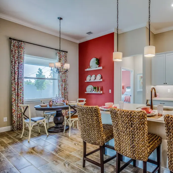Beautiful red accent wall in this nice open kitchen