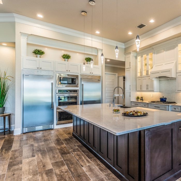 A stunning modern kitchen where culinary dreams come to life, featuring a spacious island adorned with fresh ingredients and elegant fixtures.