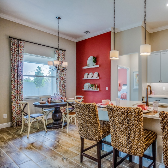 Beautiful red accent wall in this nice open kitchen